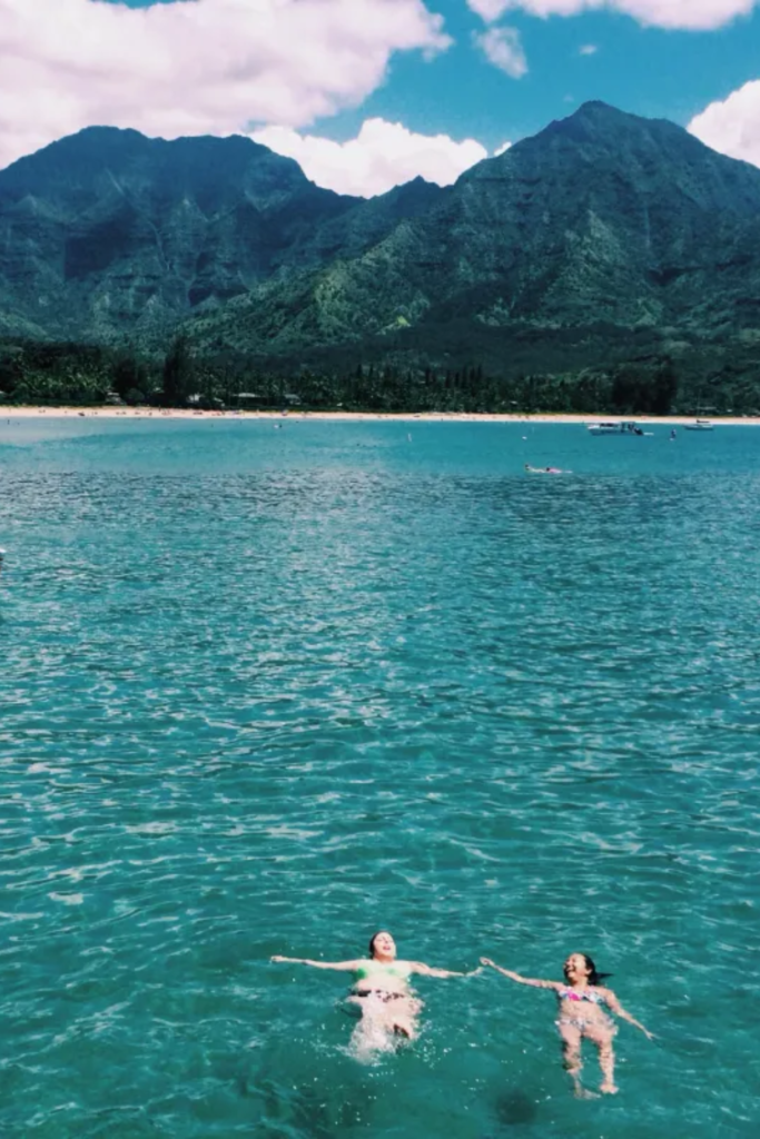 Hanalei Bay Kauai Hawaii green mountains bay sand couples babymoon 2026