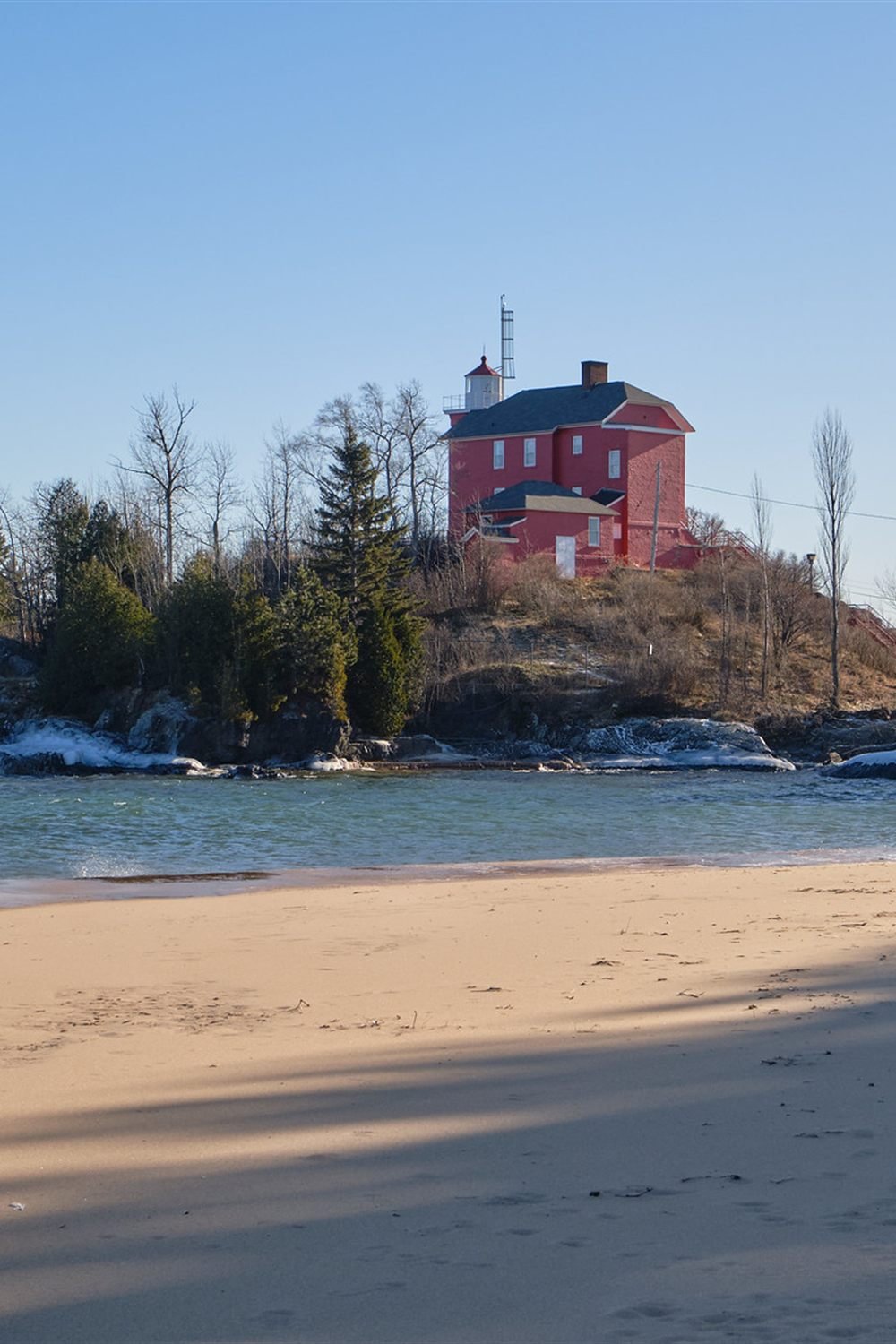 Marquette Harbor Lighthouse seen from McCarty’s Cove in winter